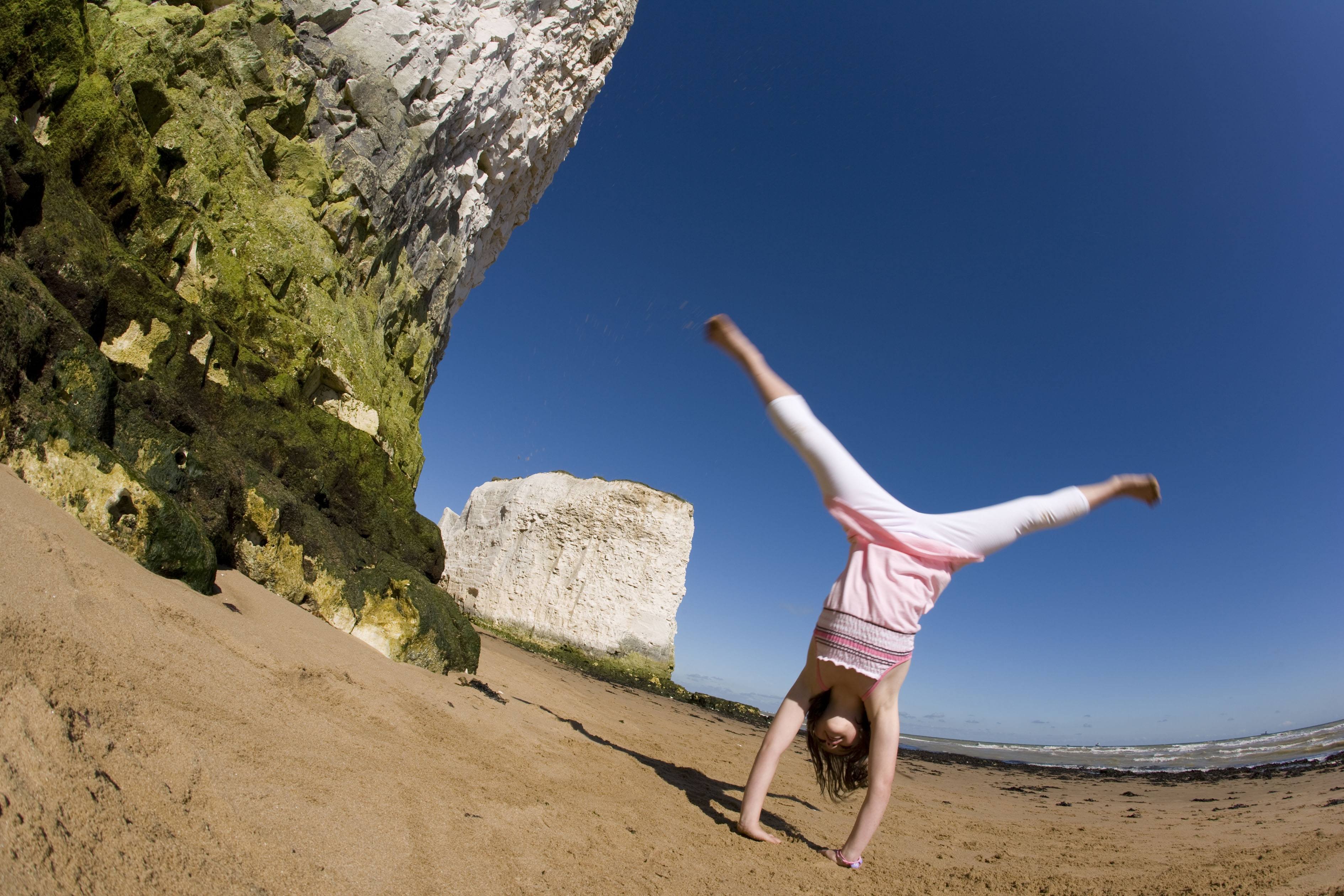 Girl cartwheel in pink.JPG